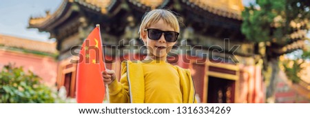 Enjoying vacation in China. Young boy with national chinese flag in Forbidden City. Travel to China with kids concept. Visa free transit 72 hours, 144 hours in China BANNER, LONG FORMAT