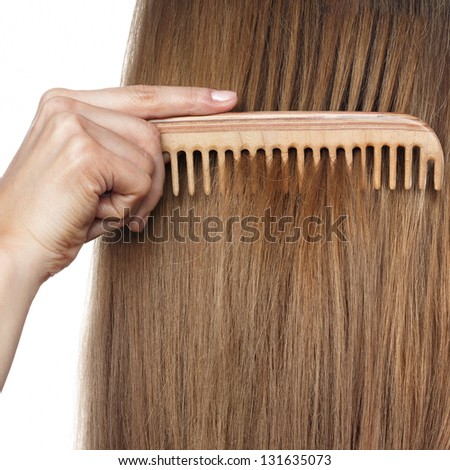 hair and comb. Space for text on hair background.