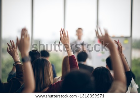 Corporate Meeting Asian Group a Question or Answers Class Audience Conference Professional Business Presentation Meeting Seminar People Royalty-Free Stock Photo #1316359571