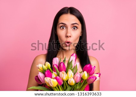 Close-up portrait of her she nice cute winsome attractive lovable lovely fascinating charming shocked brunette lady smelling early natural flowers isolated on pink pastel background