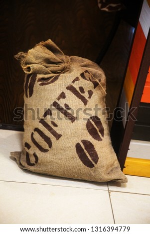A bag of coffee is on the floor