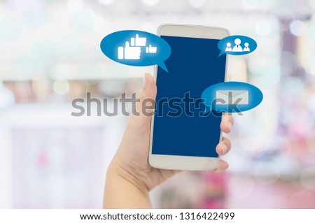 Close-up of smartphone in women holding hands Showing WiFi  Signal Sign Zone in shopping mall, Concept of convenience in shopping through intelligent network.