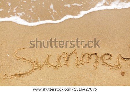 Hello summer concept. Summer text written on sandy beach and sea waves. Relaxing on tropical island. Summer vacation concept
