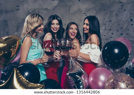 Four nice sweet lovely fascinating chic attractive gorgeous cheerful cheery positive ladies enjoying red wine nightclub having fun over gray concrete wall