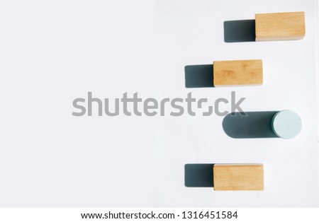 Wooden blocks.Individuality and uniqueness concept.  Light and shadow of Wooden blocks on white background.