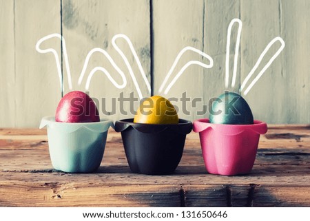 Cute creative photo with easter eggs in the nest