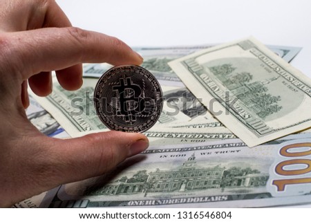 Bitcoin in hand and money