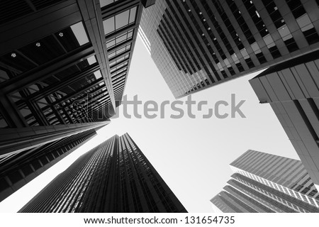Black and white abstract upward view of downtown skyscrapers.
