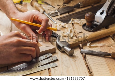 carpenter working,hammer,meter and screw-driver on construction background Royalty-Free Stock Photo #131655707