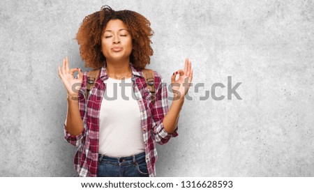 Young traveler black woman performing yoga