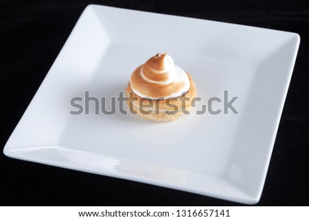 meringue mini cake on white plate
