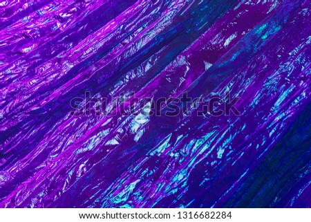 Holographic abstract neon textured background. Retro wave neon colors.