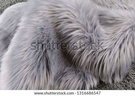 Beautiful abstract art background of detail bright colorful pattern texture shaggy fur with long fibers. Polyester synthetic or natural fluffy plaid. Comfortable home textile. Closeup palette texture
