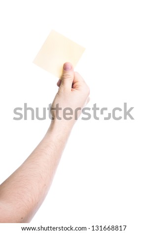 Hand holding a yellow card isolated on white background