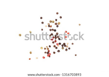 Different pepper mix isolated on white background. Black, red and white peppercorns macro closeup top view Royalty-Free Stock Photo #1316703893