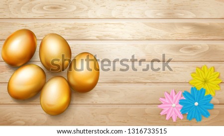 Realistic golden Easter eggs with shadows and several flowers on wooden planks