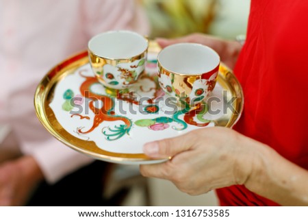 Traditional Chinese Wedding with "Double Happiness" Text Calligraphy Illustration on tea cup.