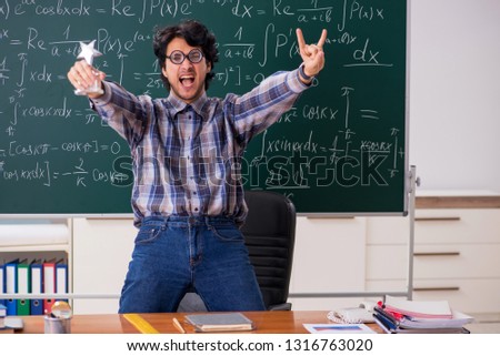 Funny male math teacher in the classroom 