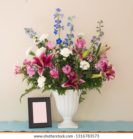 Pretty Pink and Lavender Flower Bouquet in White Vase with Blank Picture Frame with room or space for your words, text or copy.  Square crop