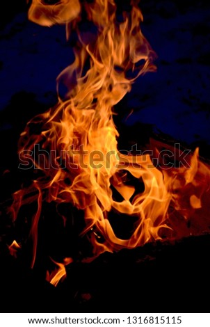 Abstract background: flame of a fire on a black background