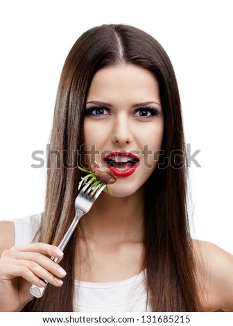 Pretty woman with red lipstick eating roast meat, isolated on white. Greasy food leads to obesity