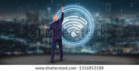 View of Businessman in front of a wall with Wifi icon with stats and binary code 3d rendering