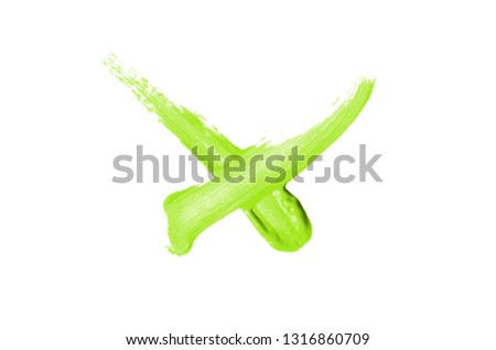 Bright liquid lipstick smear in the form of a check mark isolated on a white background. Cosmetic product stroke. Yes sign for checkbox. Light green color