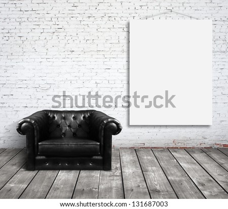 chair in room and blank poster on wall