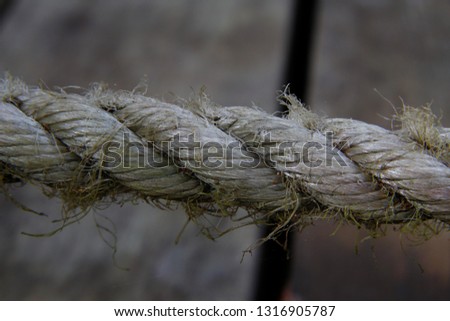 Close up picture of a worn out rope taken by camp fire.