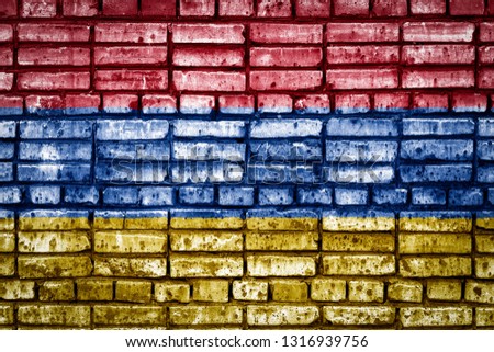 National flag of Armenia on a brick background. Concept image for Armenia: language , people and culture.
