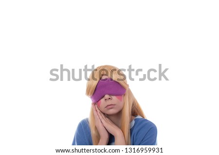 Cute young girl in star cosplay with hearts on cheeks sleep with sleep mask isolated on white background