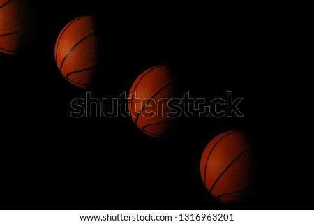 Stroboscopic photo of moving ball on dark background