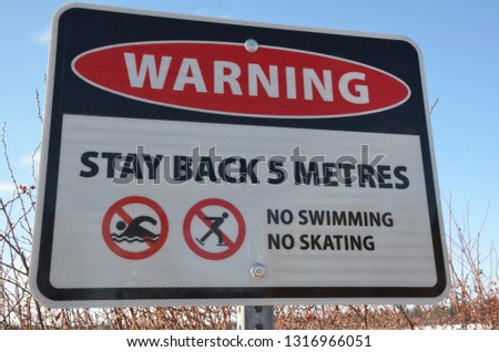 Warning sign No swimming No skating