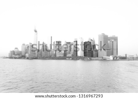 Panoramic view of lower Manhattan skyline from Staten Island, in New York, USA. High key black and white image.