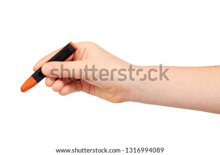 Kid hand holding color pencil, writing and drawing gesture. Isolated on white background