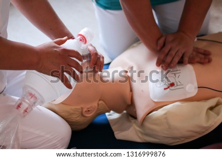 Cpr training outdoors. Reanimation procedure on CPR doll Royalty-Free Stock Photo #1316999876