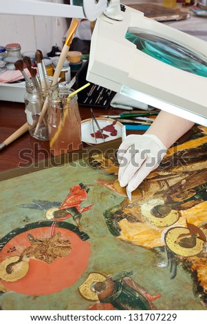 Closeup of  restoration of ancient icons in workshop