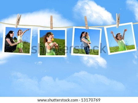 Family photographs hanging on a clothesline against a blue sky