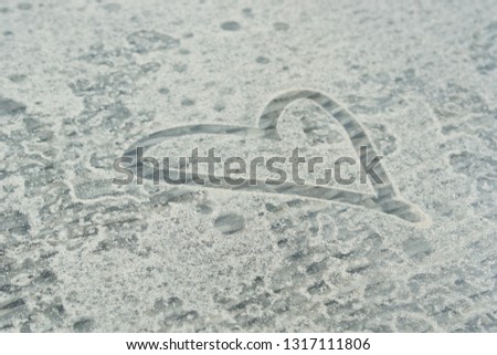 Heart on the sand background