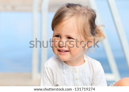 Little child smiling outdoors
