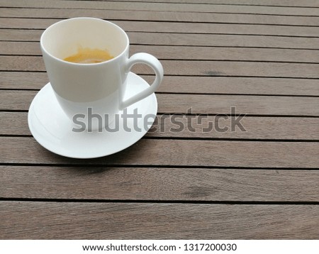 Coffee witth white blank background for mockup artwork.Wooden background with coffee outside the house.Empty wooden background.Mockup wooden.
Wooden table.