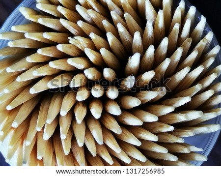 Toothpicks on wooden table for background