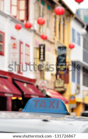 Taxi in China town, Singapore with taxi markings visible and selective focus