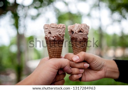 Hand pictures and chocolate ice cream, food concept with copy space