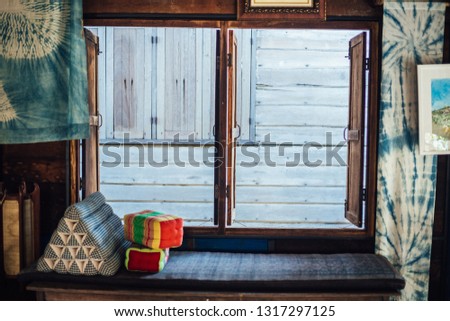 The wooden house by the window