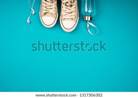 Bright multi-colored trend background and sneakers. Creative background for your project. 80, pink, blue, yellow
