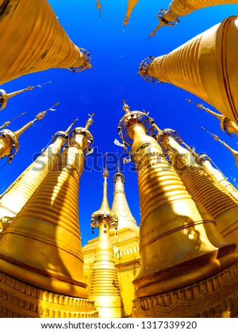 Fisheye shot of golden stupas in In Dein site on Lake Inle (Inle Lake) in Myanmar (Burma), shot with a fisheye lens