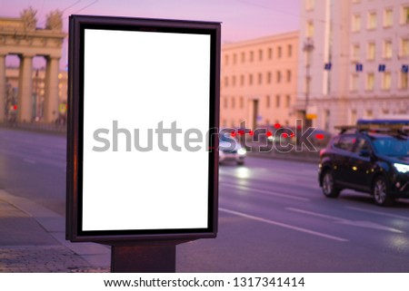 vertical billboard for posters, city format, illuminated sign near the road outdoor advertising
