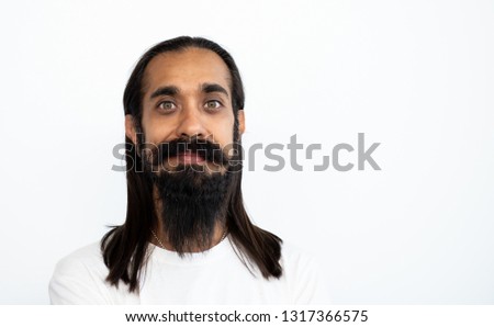 Portrait young handsome bearded man with long beard moustached and long black hair on white background, Copy space, 