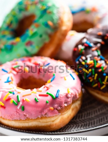 Front view of a group of sweet donuts, close up
